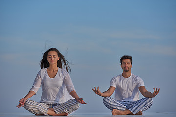 Image showing young couple practicing yoga