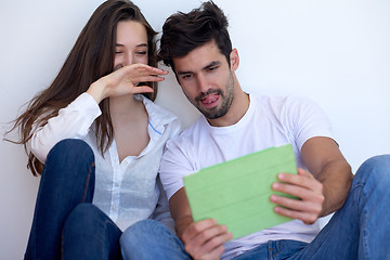 Image showing couple at modern home using tablet computer