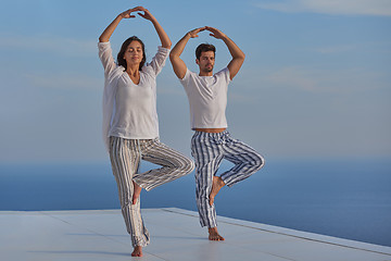 Image showing young couple practicing yoga