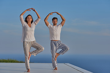 Image showing young couple practicing yoga