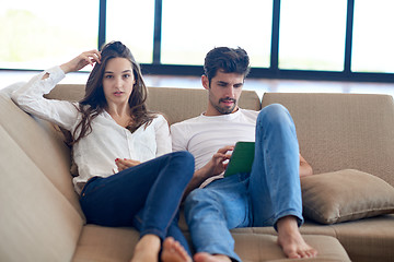 Image showing couple at modern home using tablet computer