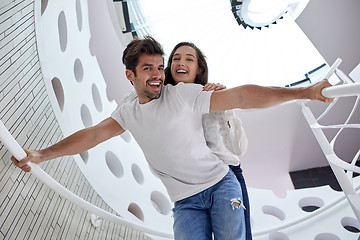 Image showing relaxed yung couple at home  stairs