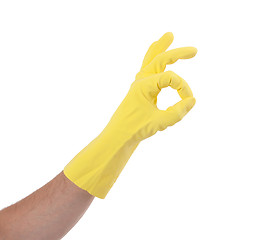 Image showing Hand gesturing with yellow cleaning product glove