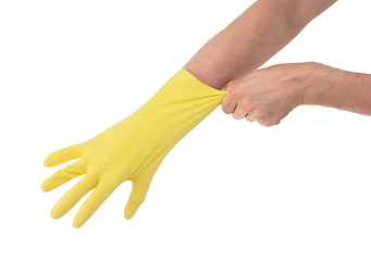 Image showing Hand in yellow glove