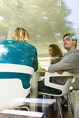 Image showing Three business colleagues communicating during break