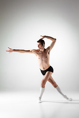 Image showing The young attractive modern ballet dancer on white background