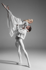 Image showing Two young ballet dancers practicing. attractive dancing performers  in white 