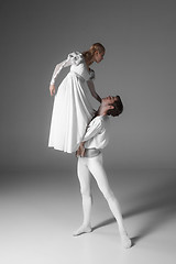 Image showing Two young ballet dancers practicing. attractive dancing performers  in white 