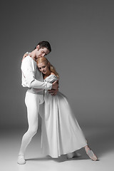 Image showing Two young ballet dancers practicing. attractive dancing performers  in white 