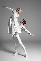 Image showing Two young ballet dancers practicing. attractive dancing performers  in white 