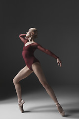 Image showing Young beautiful modern style dancer posing on a studio background