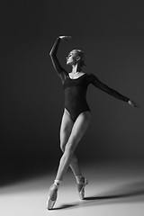 Image showing Young beautiful modern style dancer posing on a studio background