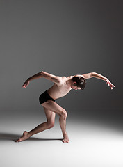 Image showing The young attractive modern ballet dancer on white background