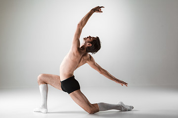 Image showing The young attractive modern ballet dancer on white background