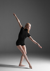 Image showing Young beautiful modern style dancer posing on a studio background