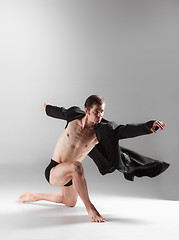 Image showing The young attractive modern ballet dancer on white background