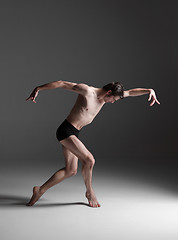 Image showing The young attractive modern ballet dancer on white background