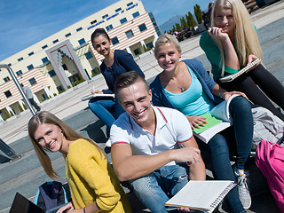 Image showing students outside sitting on steps