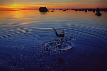 Image showing Sunset river perch fishing with the boat and a rod