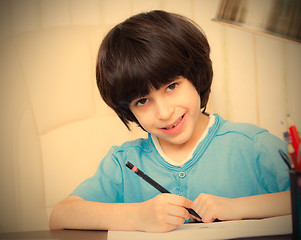 Image showing child doing homework with computer, portrait