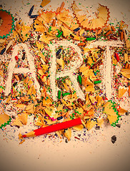 Image showing art word on the background of colored pencil shavings