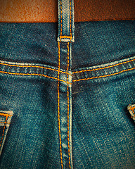 Image showing ol blue denim with seams and leather belt 