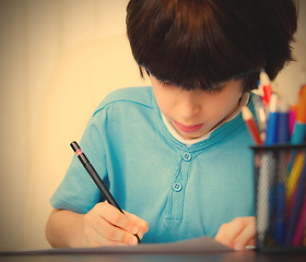 Image showing Boy doing homework