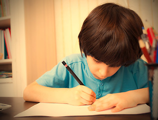 Image showing schoolboy doing homework