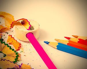 Image showing set of colored pencils, sharpener and shavings 