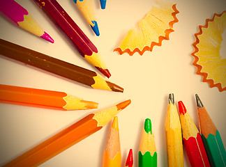 Image showing colored pencils and shavings on white background