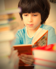 Image showing boy reading a book