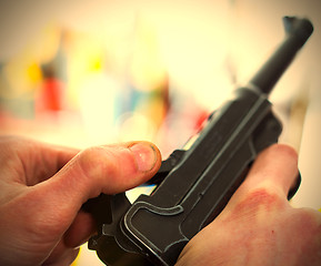 Image showing Luger automatic pistol in a human hands