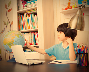 Image showing studying geography, boy and globe