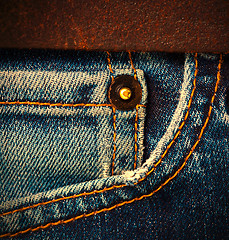 Image showing jeans with a brown leather belt