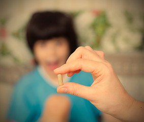 Image showing hand of a doctor with pill