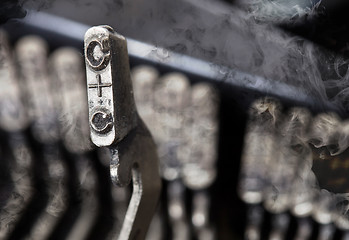 Image showing C hammer - old manual typewriter - mystery smoke