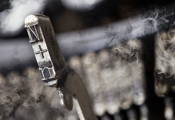 Image showing N hammer - old manual typewriter - mystery smoke