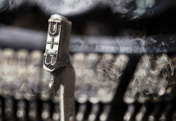 Image showing U hammer - old manual typewriter - mystery smoke