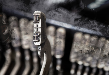 Image showing F hammer - old manual typewriter - mystery smoke