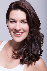 Image showing Portrait beautiful woman with dark hair smiling in the camera