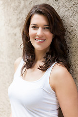 Image showing Portrait beautiful woman with dark hair smiling in the camera