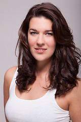 Image showing Portrait beautiful woman with dark hair smiling in the camera