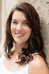 Image showing Portrait beautiful woman with dark hair smiling in the camera