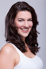 Image showing Portrait beautiful woman with dark hair smiling in the camera