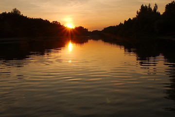 Image showing Sunset over a river