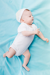 Image showing Baby in hat lying