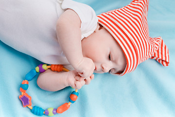 Image showing Baby in hat lying