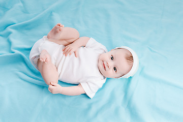 Image showing Baby in hat lying