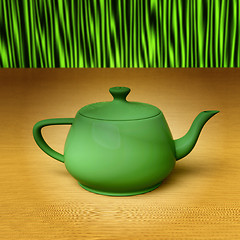 Image showing Green teapot on a bamboo mat