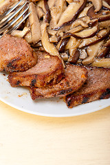 Image showing venison deer game filet and wild mushrooms